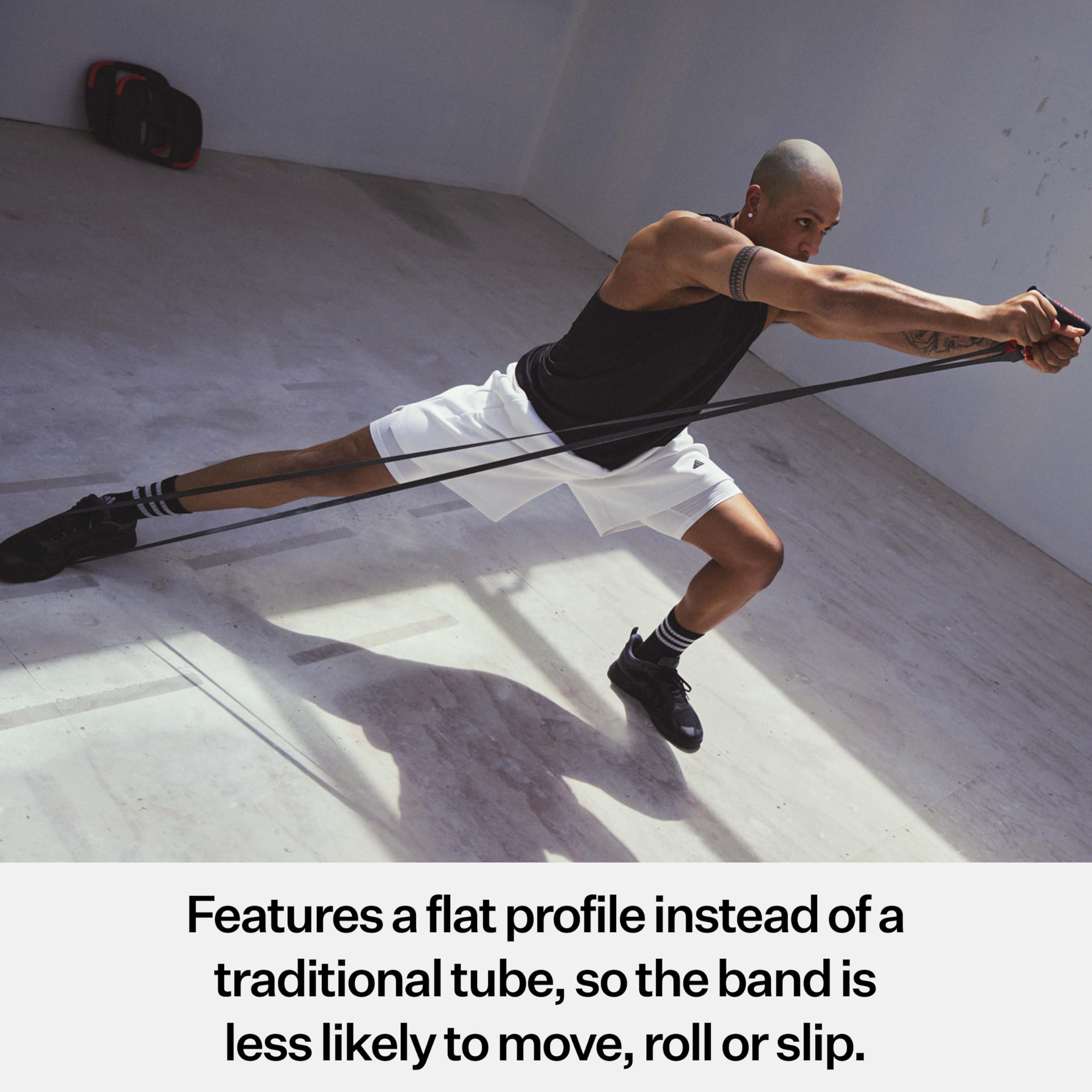 Les Mills SMARTBAND next to ruler showing 48-inch length for universal fit benefit
