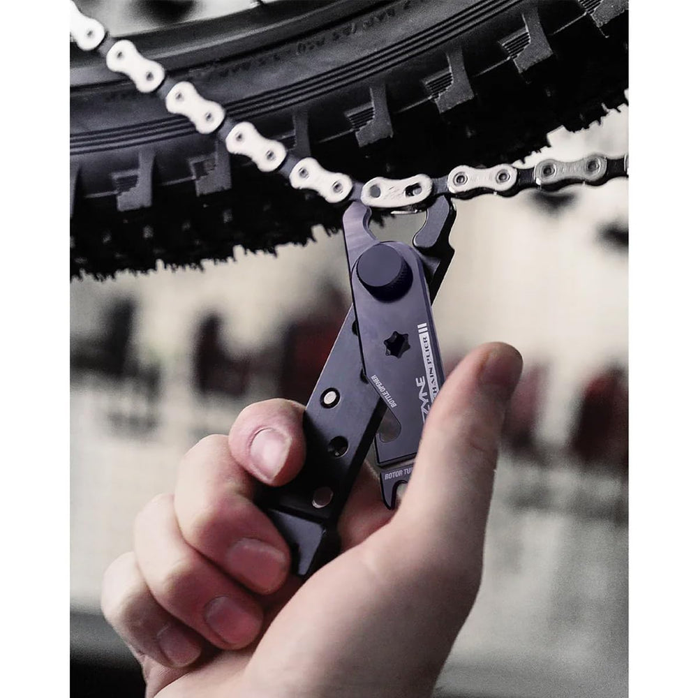 LEZYNE rotor aligner in use straightening disc rotor for reduced brake rub benefit
