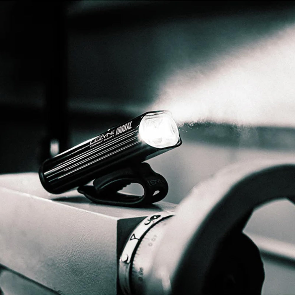 LEZYNE lights held in hand showing compact size and lightweight benefit