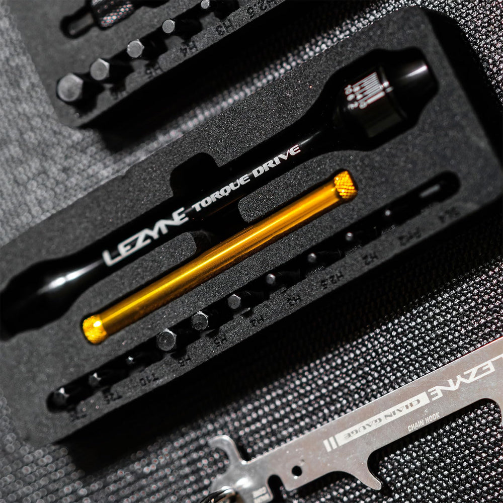 LEZYNE torque Drive beside a coin showing compact scale and travel-friendly size