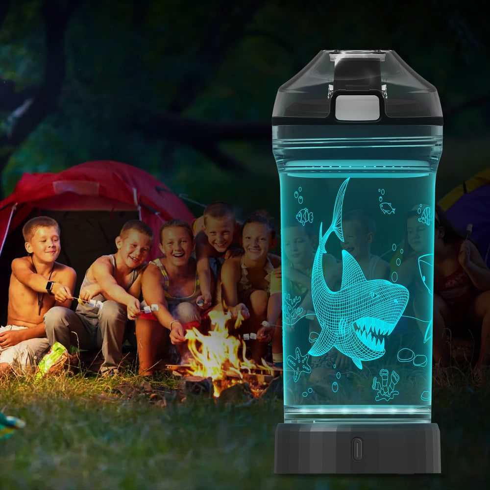 Lightzz shark bottle in child's hands at park emphasizing everyday durability