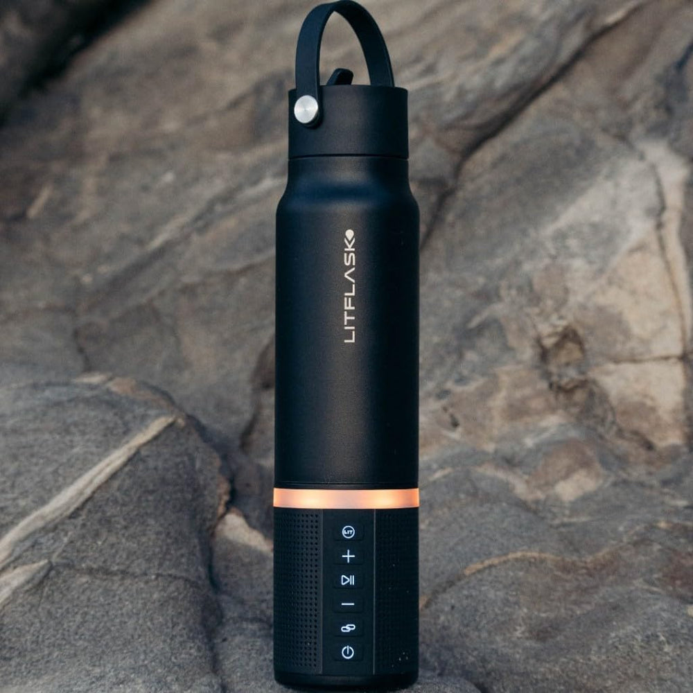 LitFlask beside smartphone showing size and 5000 mAh charging convenience