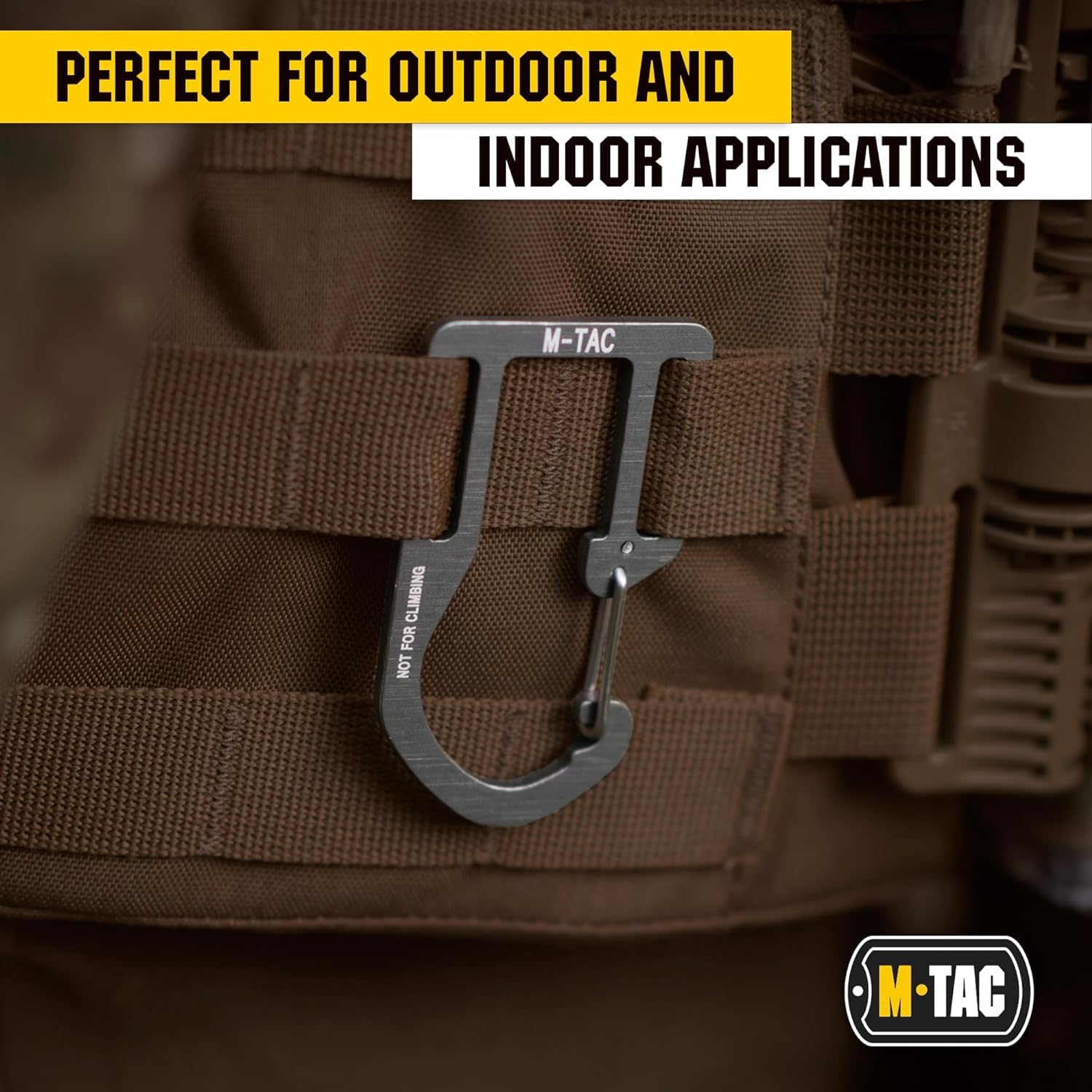 M-Tac carabiner on backpack in outdoor setting showing corrosion resistance and reliable carry benefit