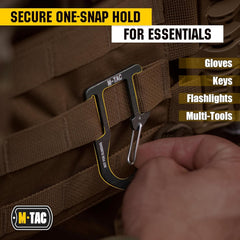 M-Tac carabiner clipped to molle strap showing easy attachment and fast access benefit