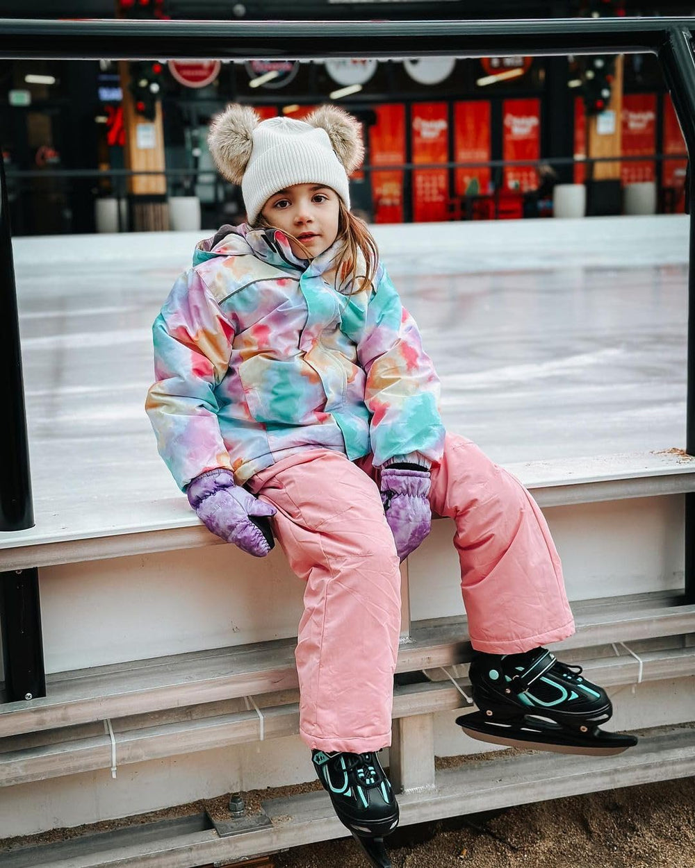 MammyGol kid wearing skates on ice showing secure fit and confident beginner stance