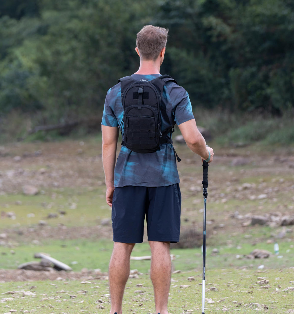 MARCHWAY hydration pack worn by hiker showing hands-free drinking benefit