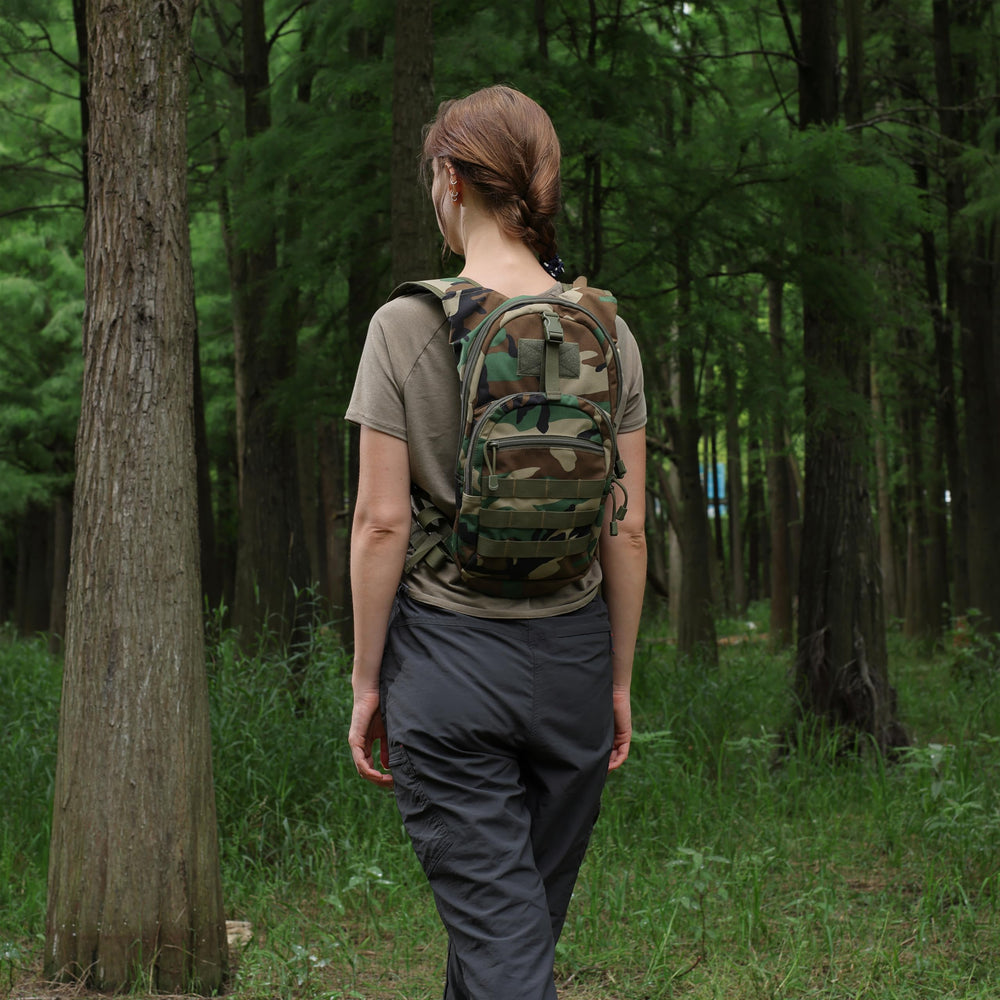 MARCHWAY beside a water bottle for scale to illustrate compact daypack size