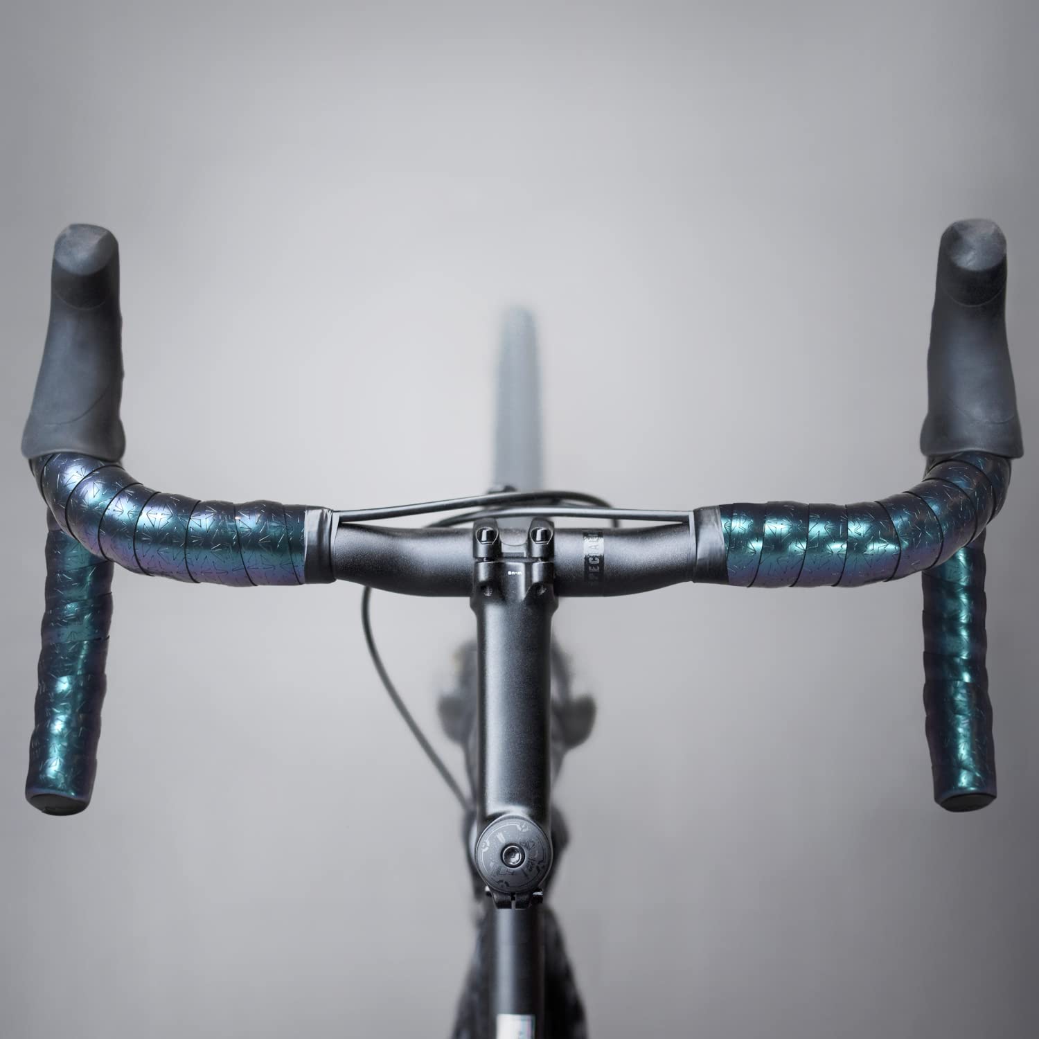 MARQUE Galaxy Plus on a road bike in motion, conveys durable performance and style