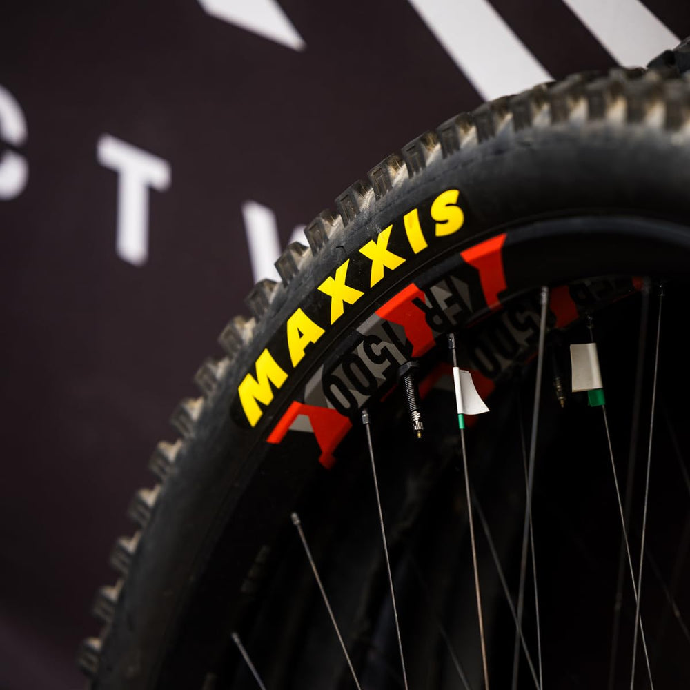 MAXXIS packaged tire label showing size, rating, and tubeless-ready benefit