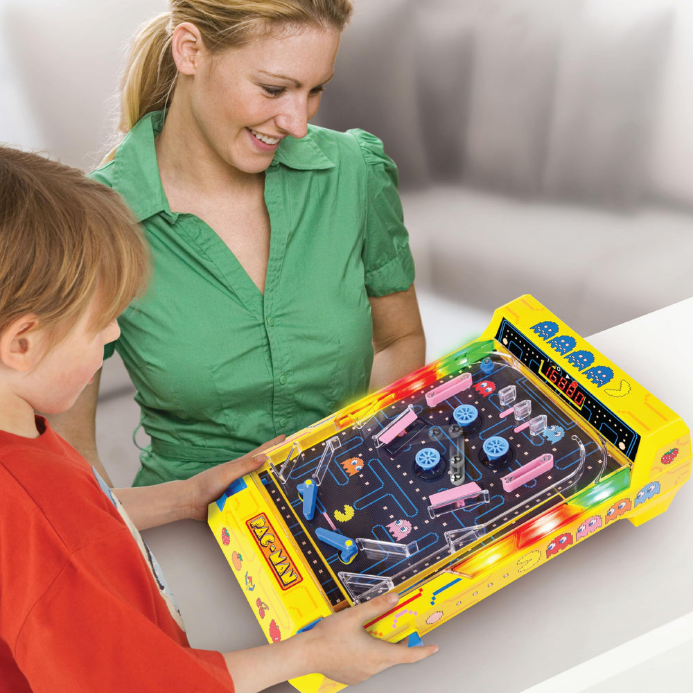Merchant Ambassador PAC-MAN family around table enjoying competitive pinball rounds