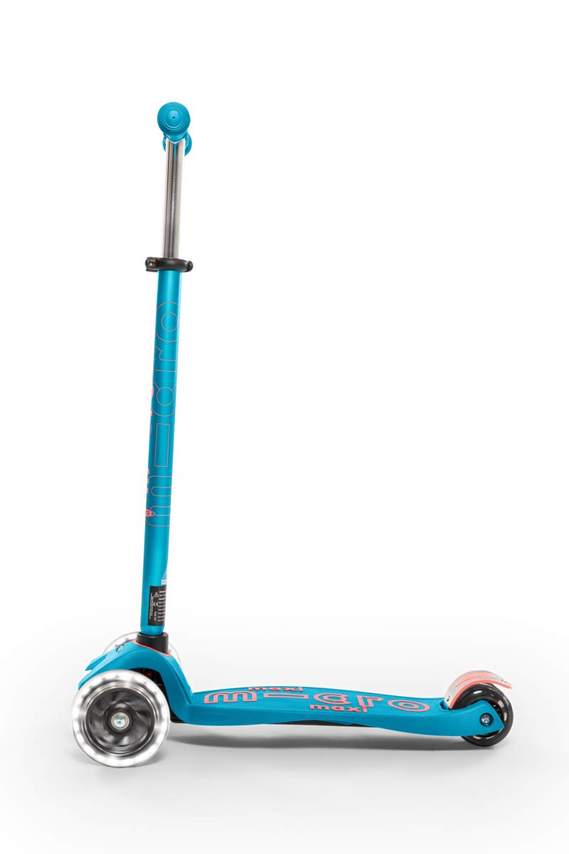 Child riding Micro Maxi on sidewalk enjoying smooth, controlled carving motion