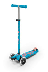 Micro Maxi front view showing aqua and pink graphics and stable three‑wheel stance