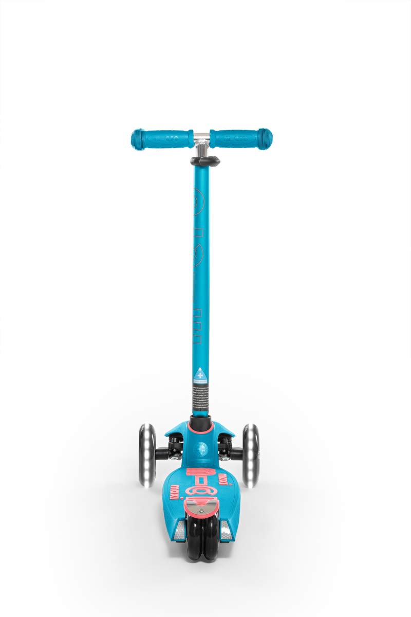 Micro Maxi next to a backpack to show scale and suitability for ages 5–12