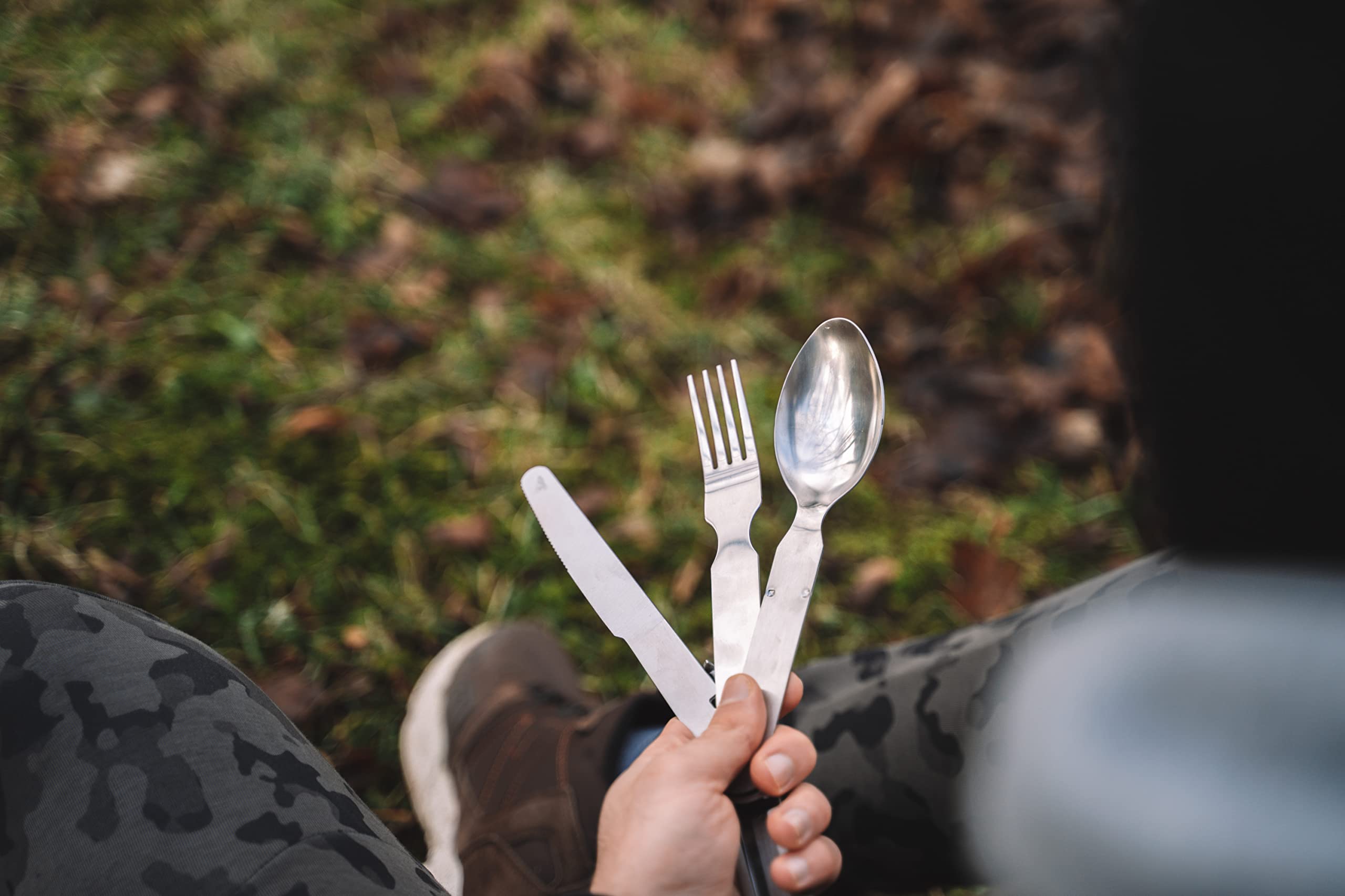 Militar cutlery in campsite setting showing reliable outdoor meal readiness