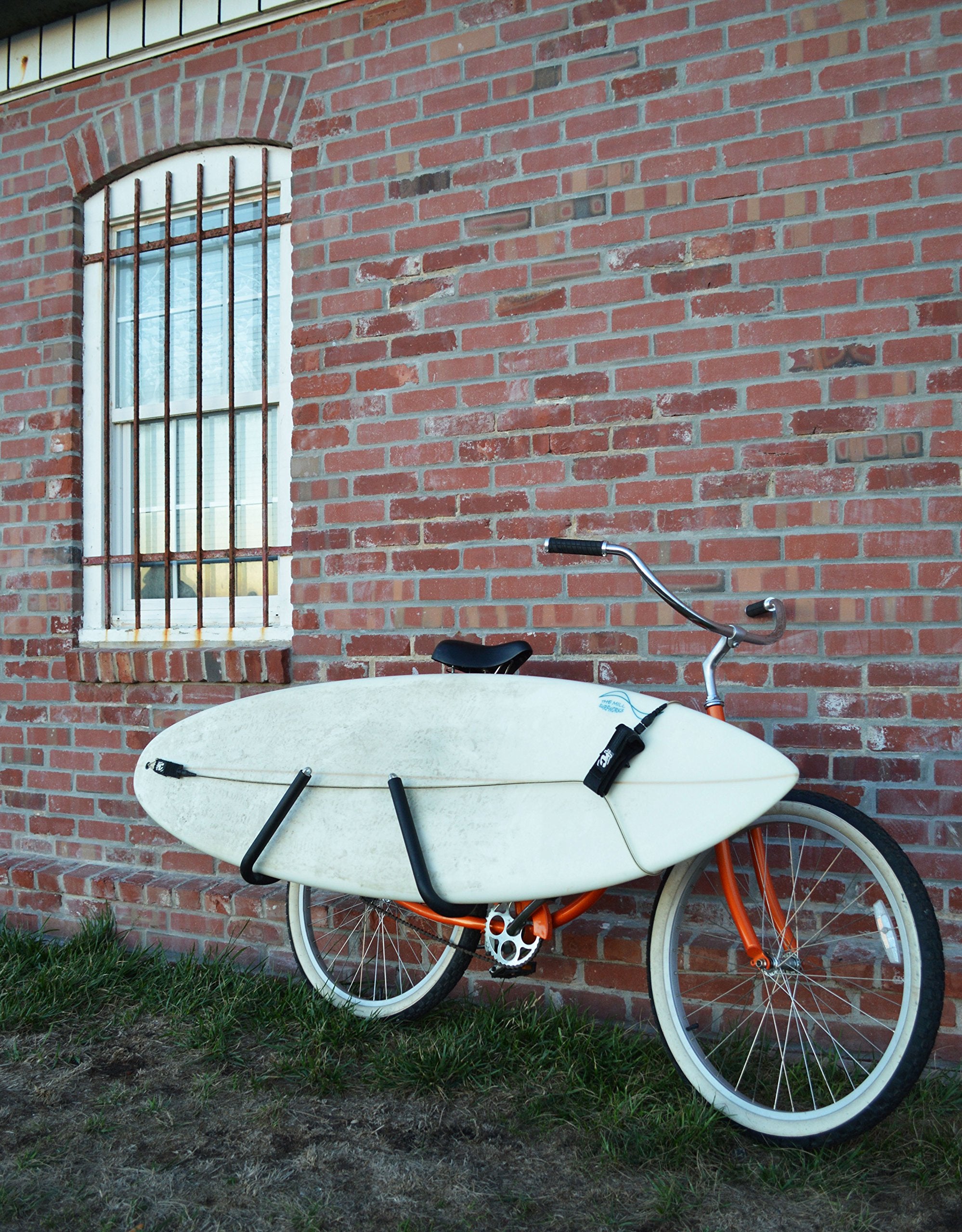 Moved By Bikes side view with shortboard mounted showing balanced carry and clearance