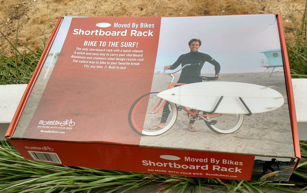 Moved By Bikes stowed rack folded against seatpost showing low-profile convenience