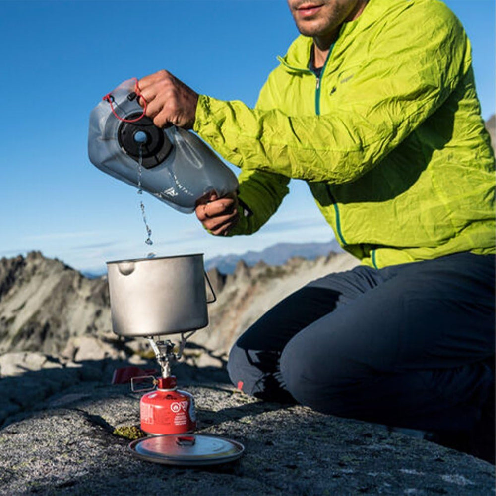 MSR DromLite inside backpack demonstrating compact size and weight savings