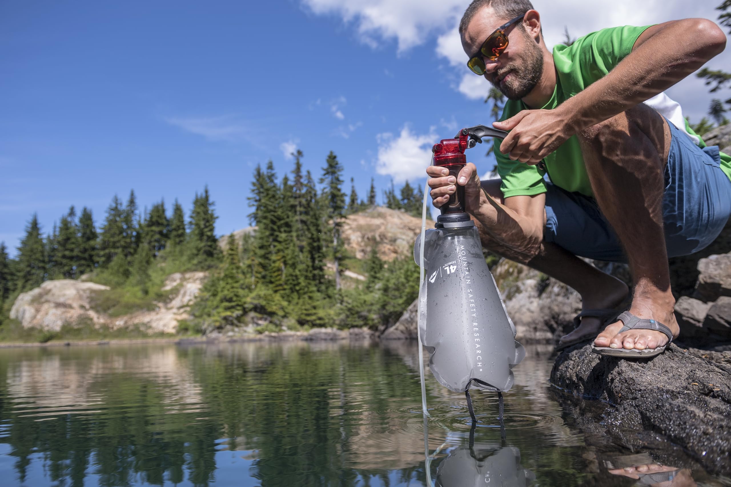 MSR MiniWorks pump in use at campsite showing fast liter-per-minute pumping convenience