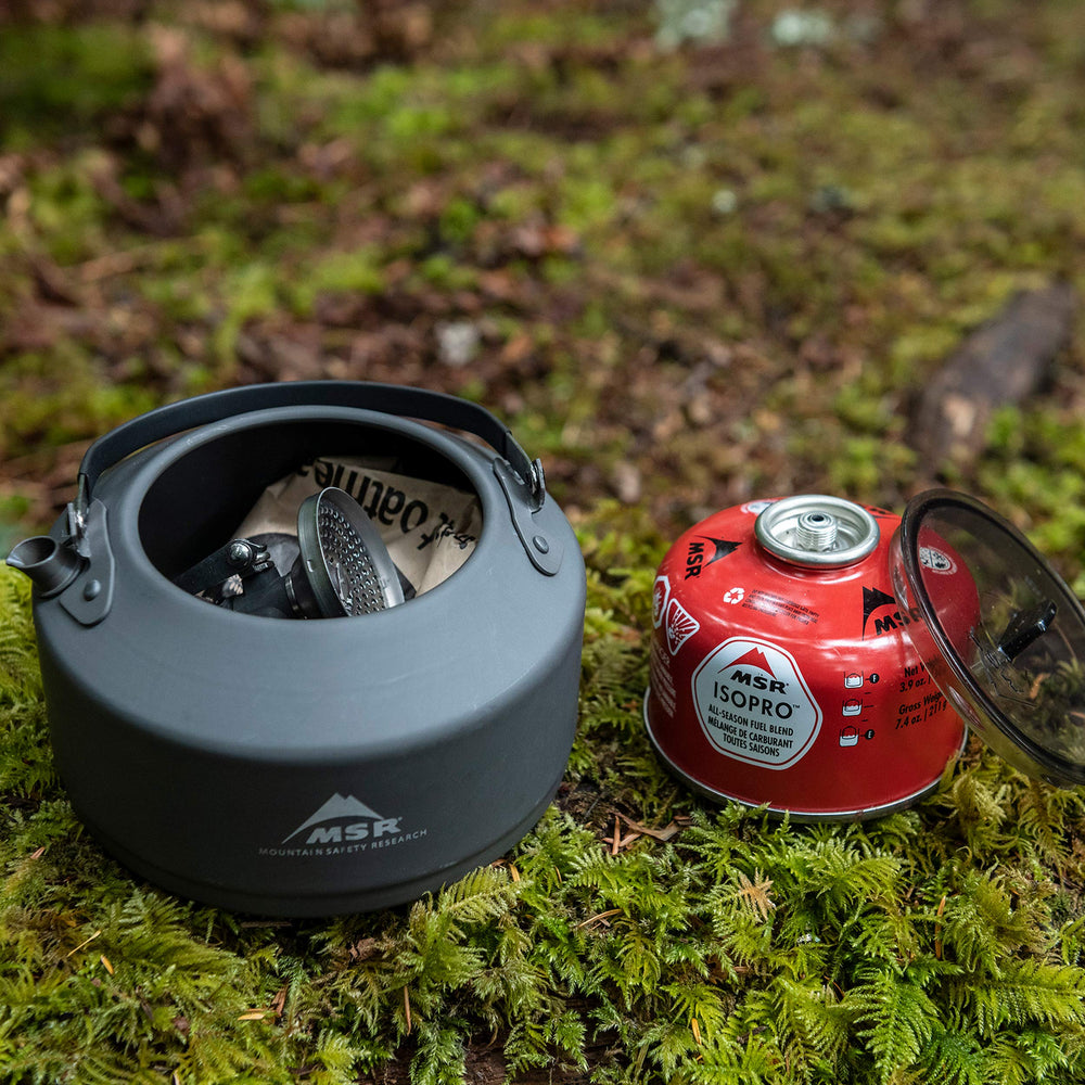 MSR Pika next to a water bottle for scale, highlighting its small packed footprint