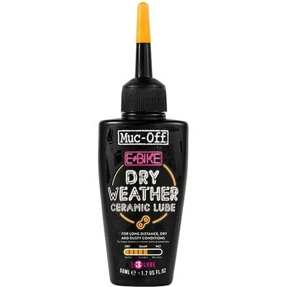 Muc-Off kit beside an electric bike in garage for convenient maintenance