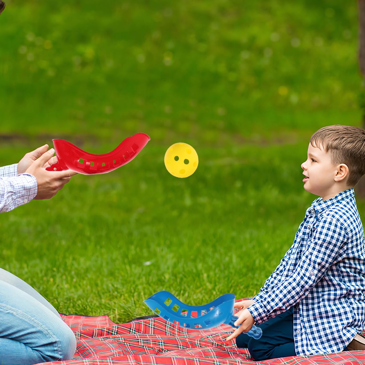 MUCKLILY scoop game in use on a sandy beach showing durability and outdoor fun