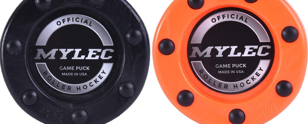 Mylec puck in use on a street hockey surface demonstrating stable glide and control