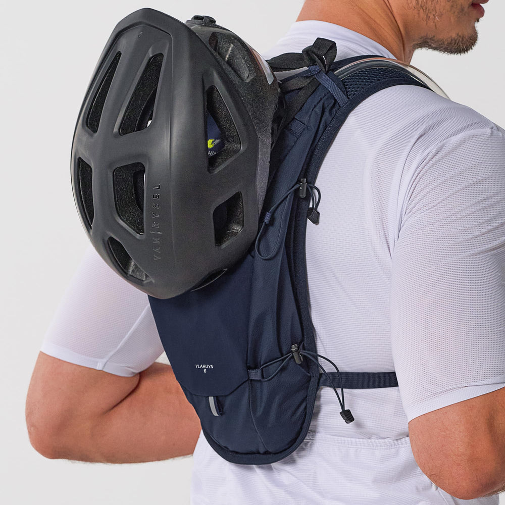 N NEVO RHINO elastic cord securing a helmet to the pack for transport convenience