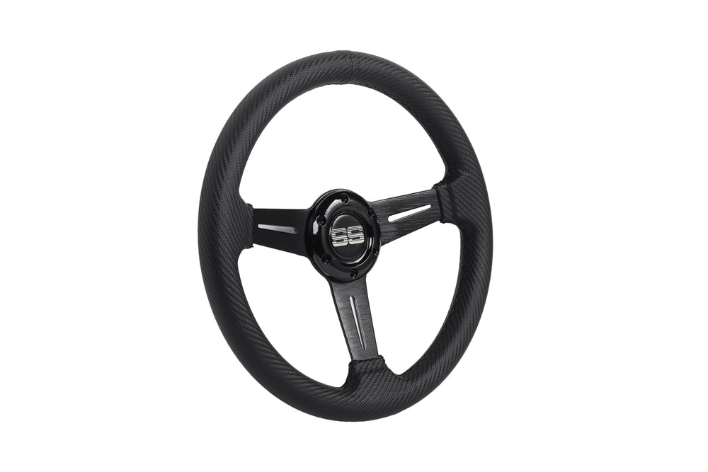 N2MU steering wheel beside a ruler showing 13-inch scale for accurate size comparison