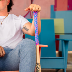 Naked Grips in-use on bat with batter demonstrating secure tack and confident swing