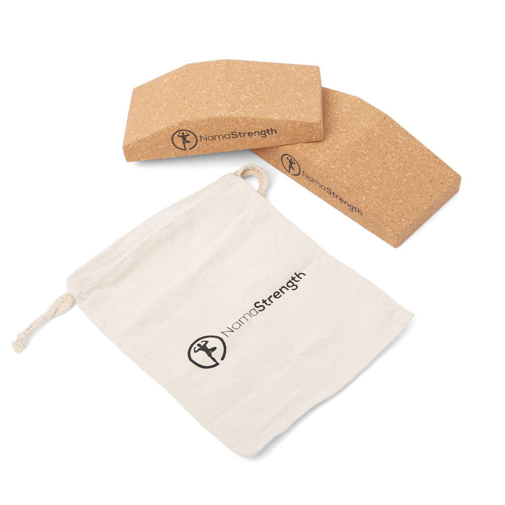 NamaStrength wedge beside a hand to show true size and ergonomic scale