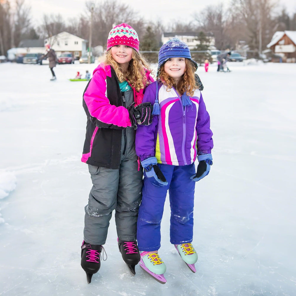 Nattork child wearing teal skates on outdoor pond enjoying winter activity