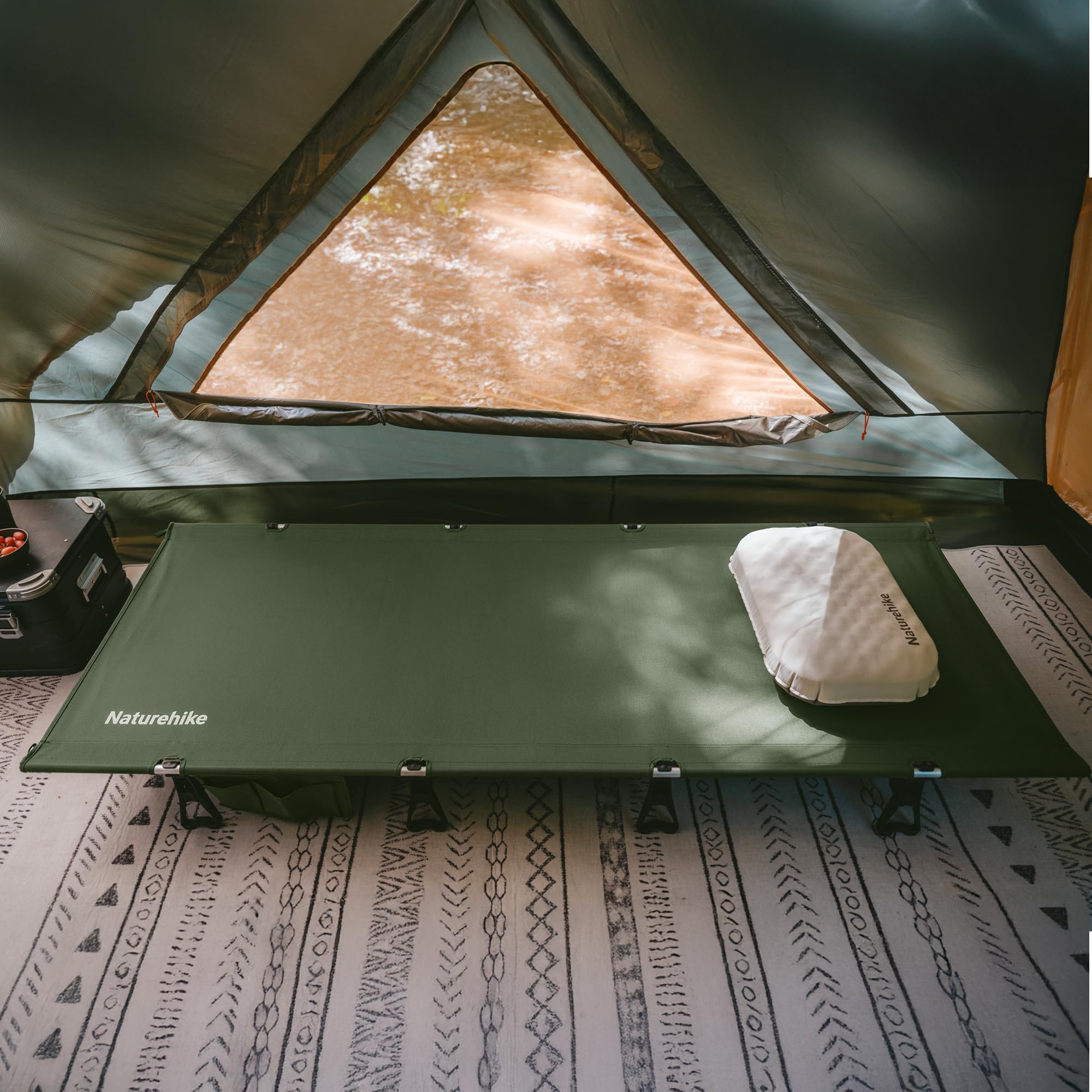 Naturehike cot in beach camping scene demonstrating portability and relaxed outdoor use