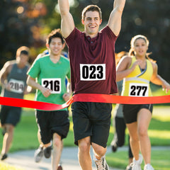 NELOMO bib in rain demonstrating waterproof performance and number legibility
