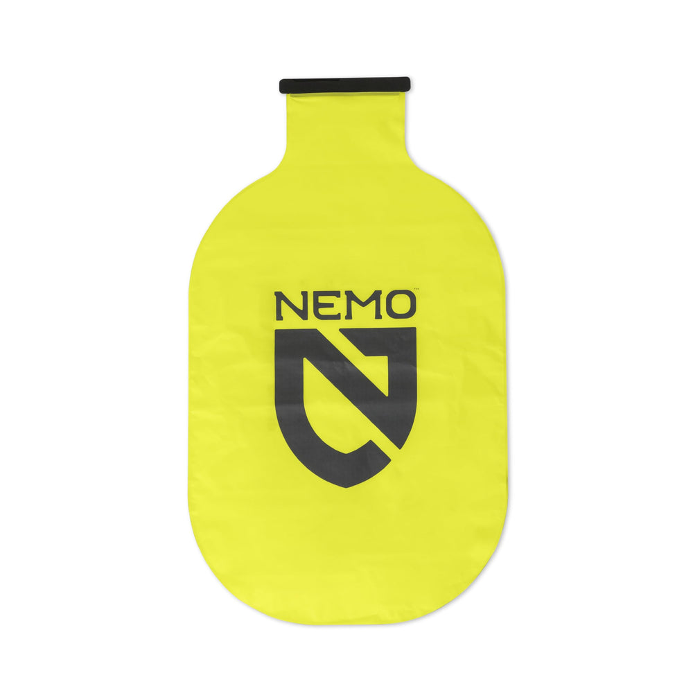 NEMO Equipment rolled pump sack beside marker illustrating ultracompact packing advantage
