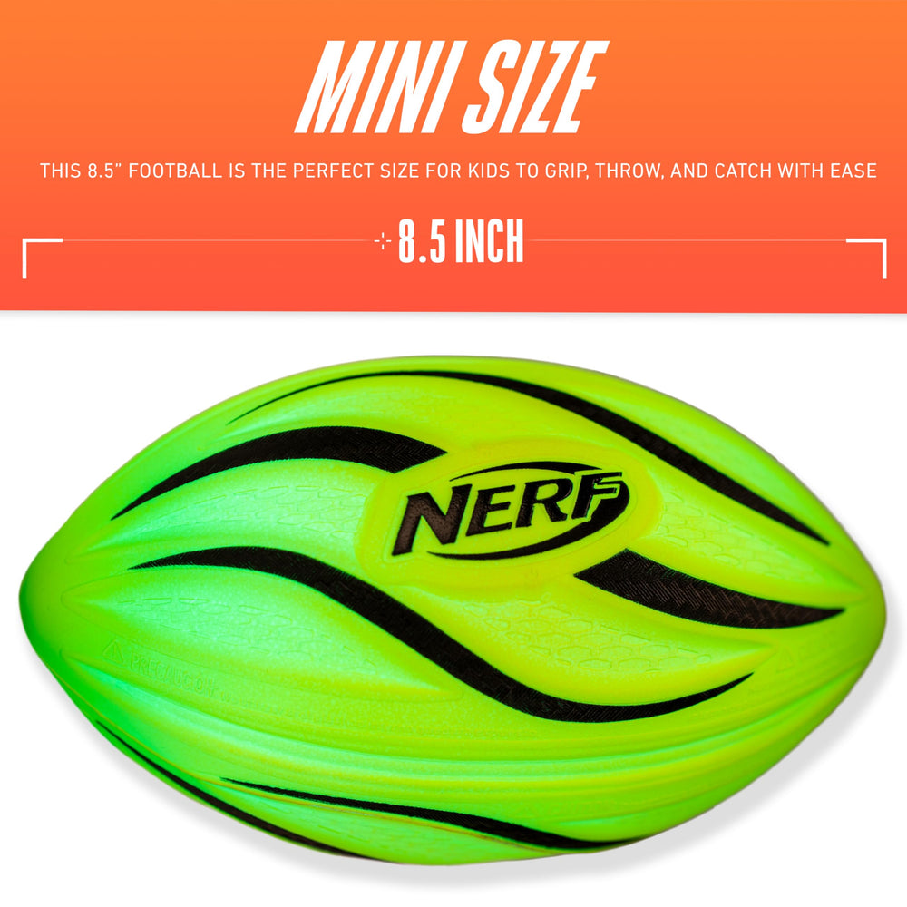 NERF football glowing at dusk showing color-changing lights for night play