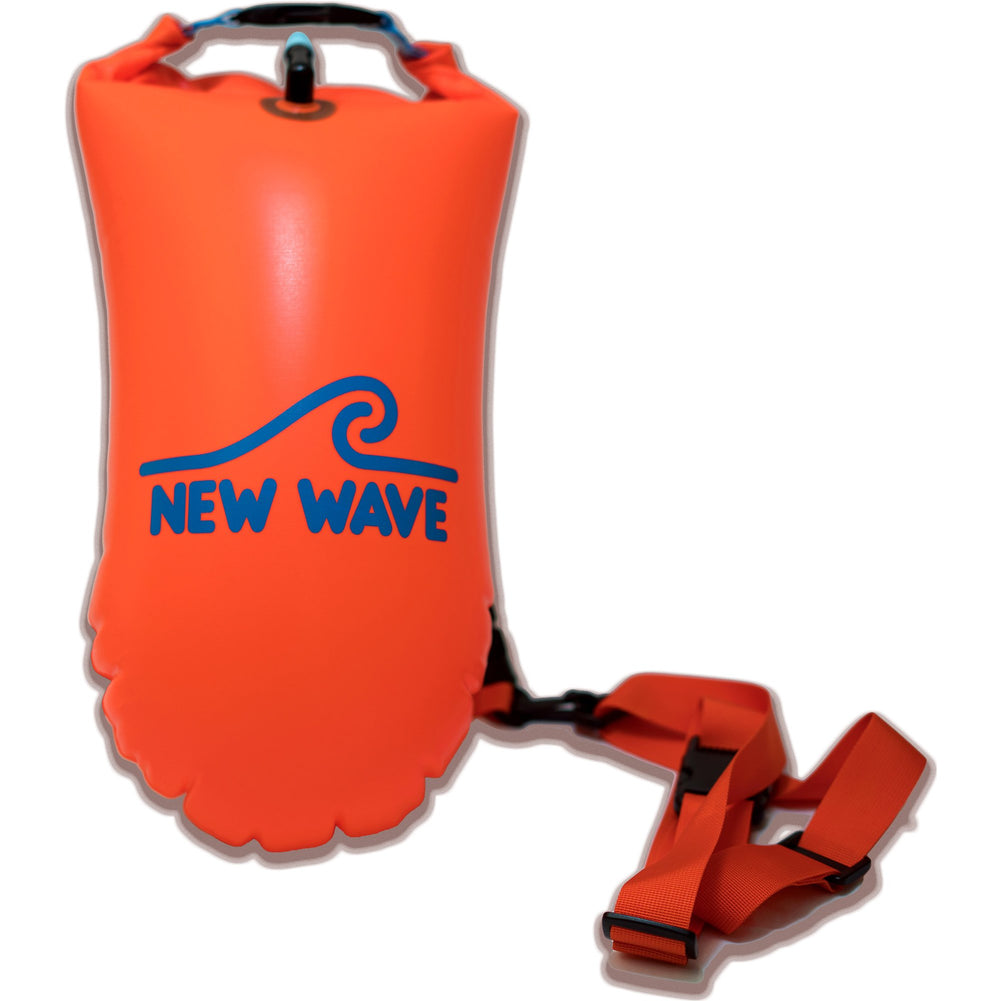 New Wave Swim Buoy tethered to swimmer in open water showing improved safety visibility