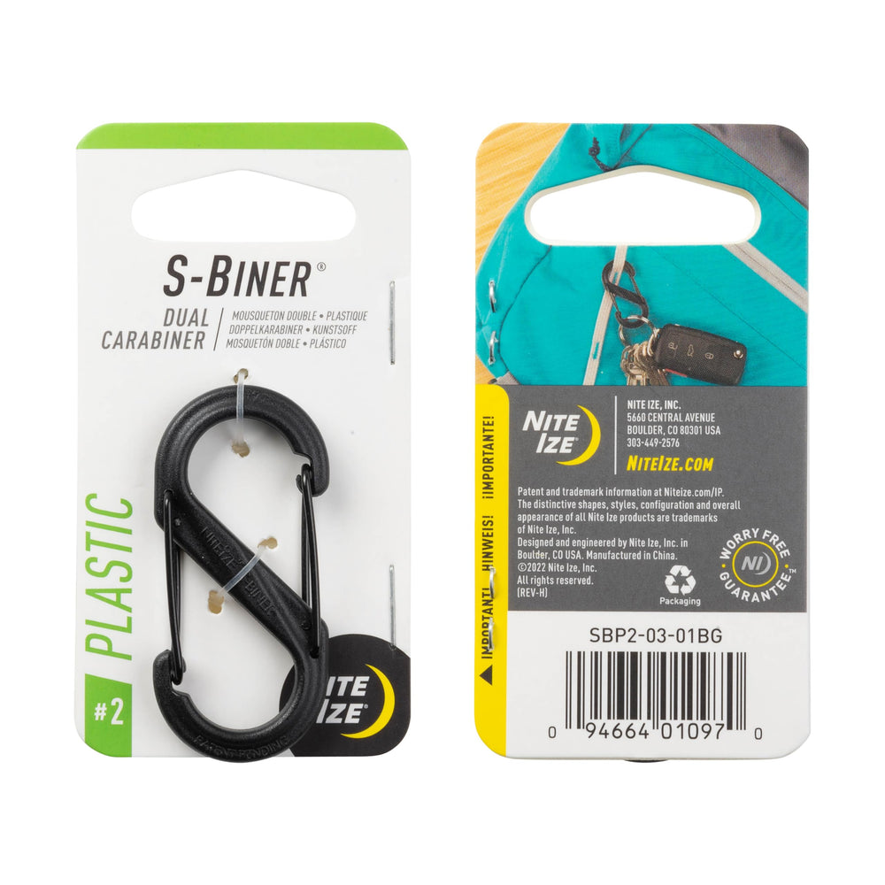 Nite Ize clipped to a backpack strap showing easy attachment and fast access on the trail