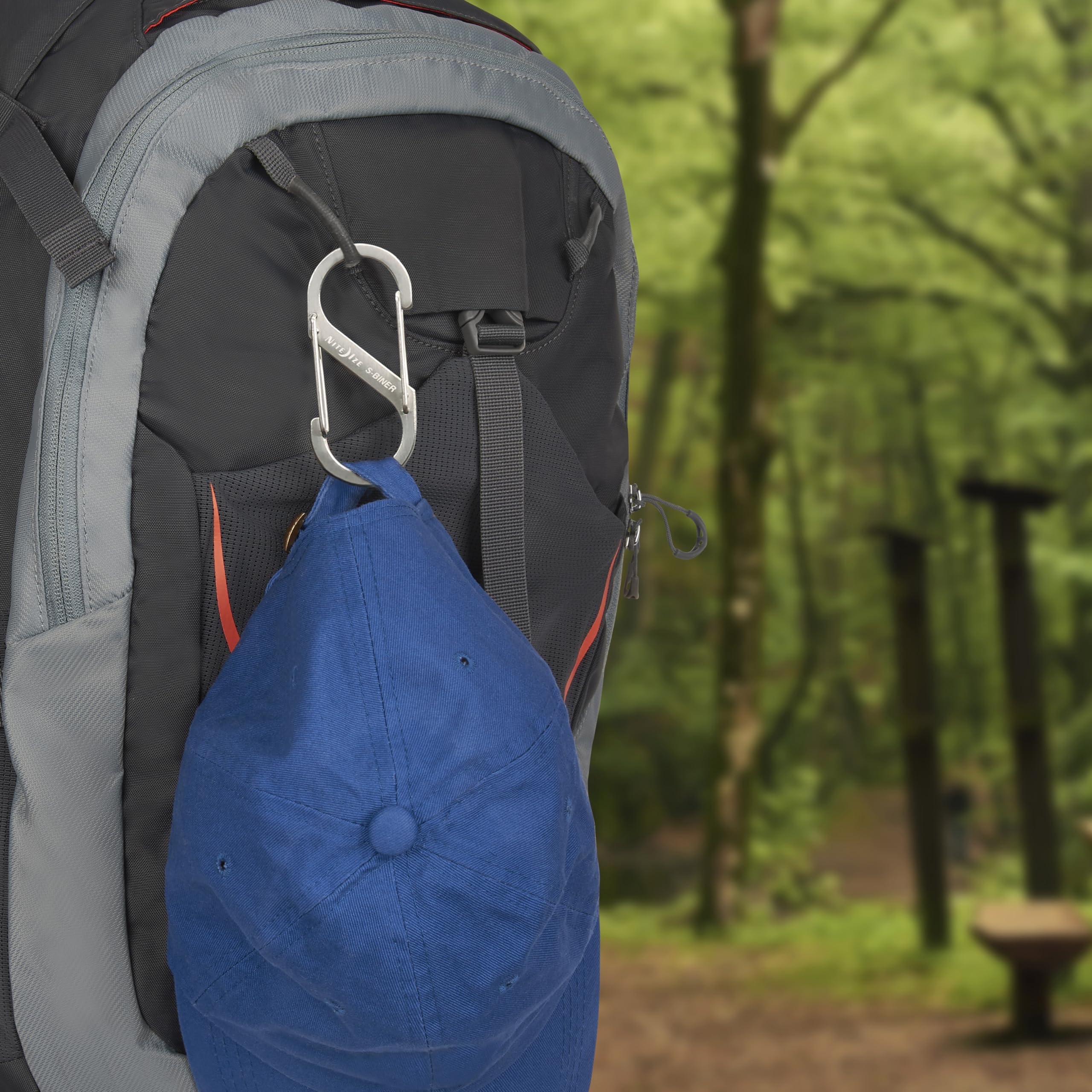 Nite Ize S-Biner size comparison beside coin showing scale and carry convenience