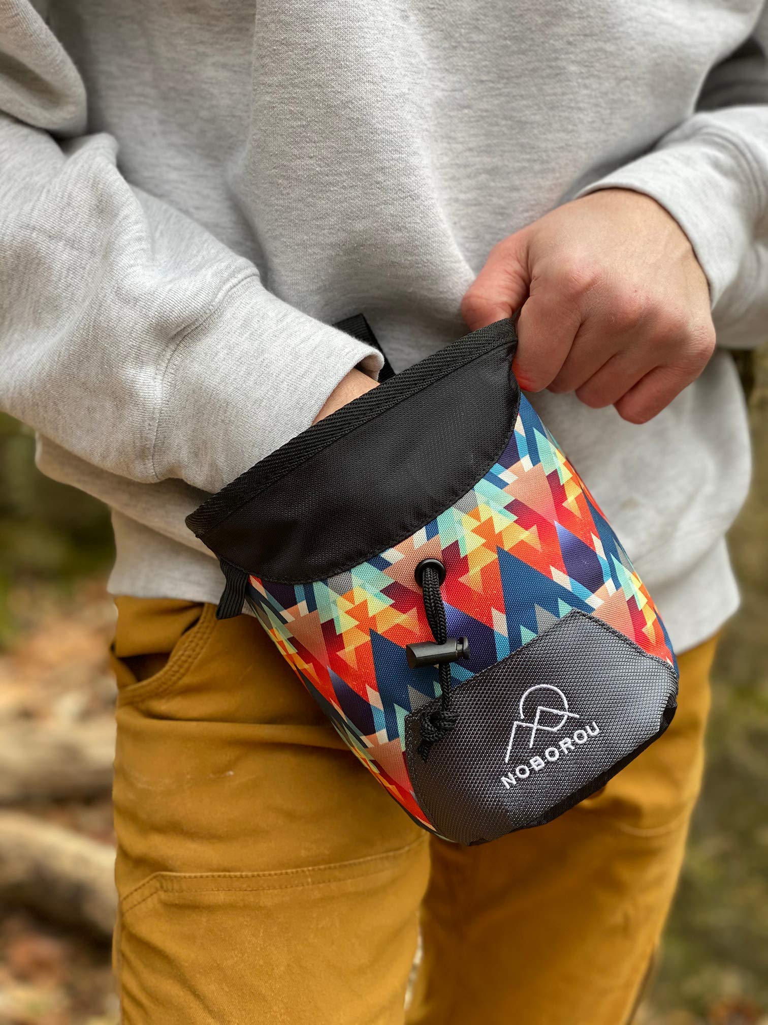 NOBOROU chalk bag on a climber at a crag showing on-route convenience benefit
