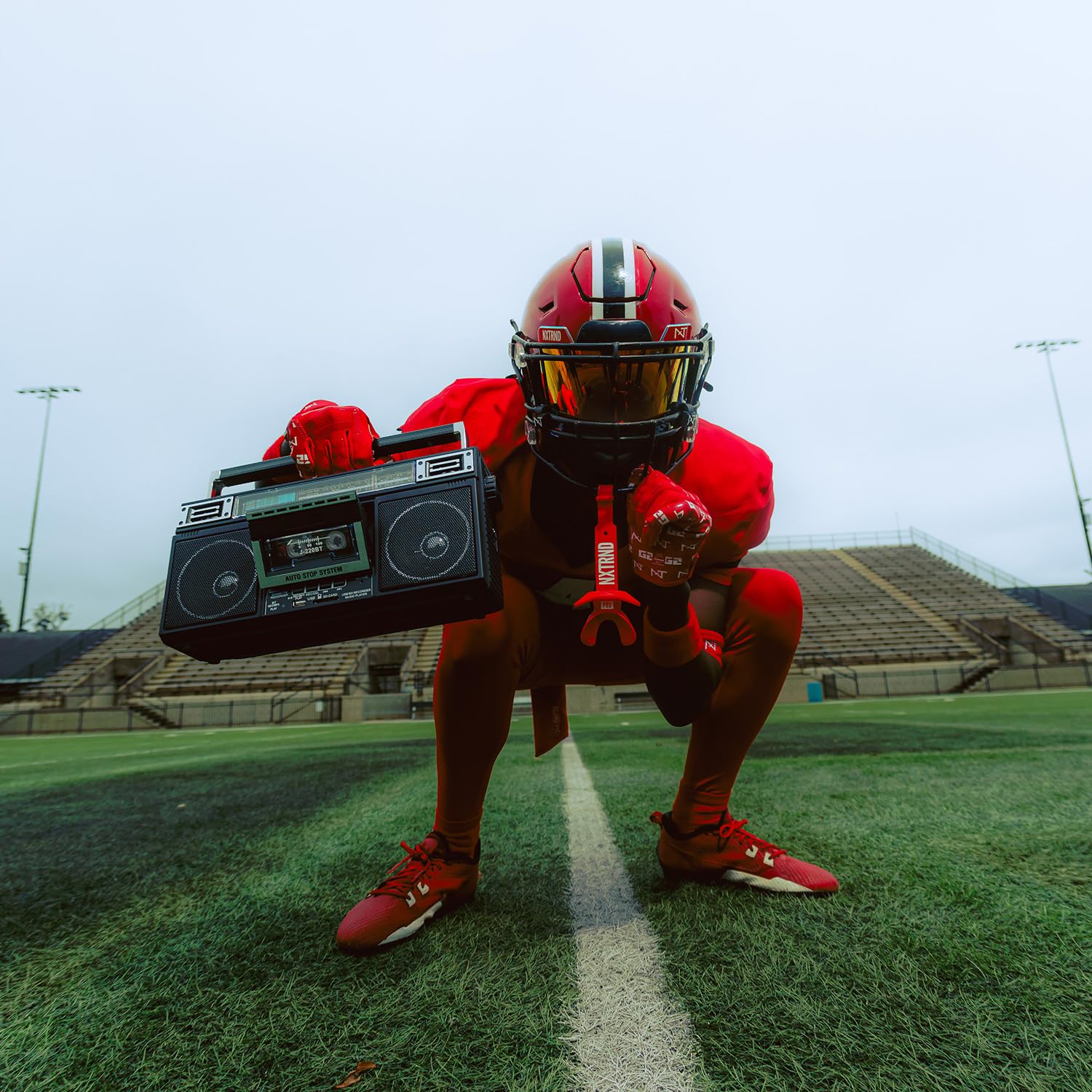 NXT NXTRND red mouthguard on sideline gear showing visibility and quick access