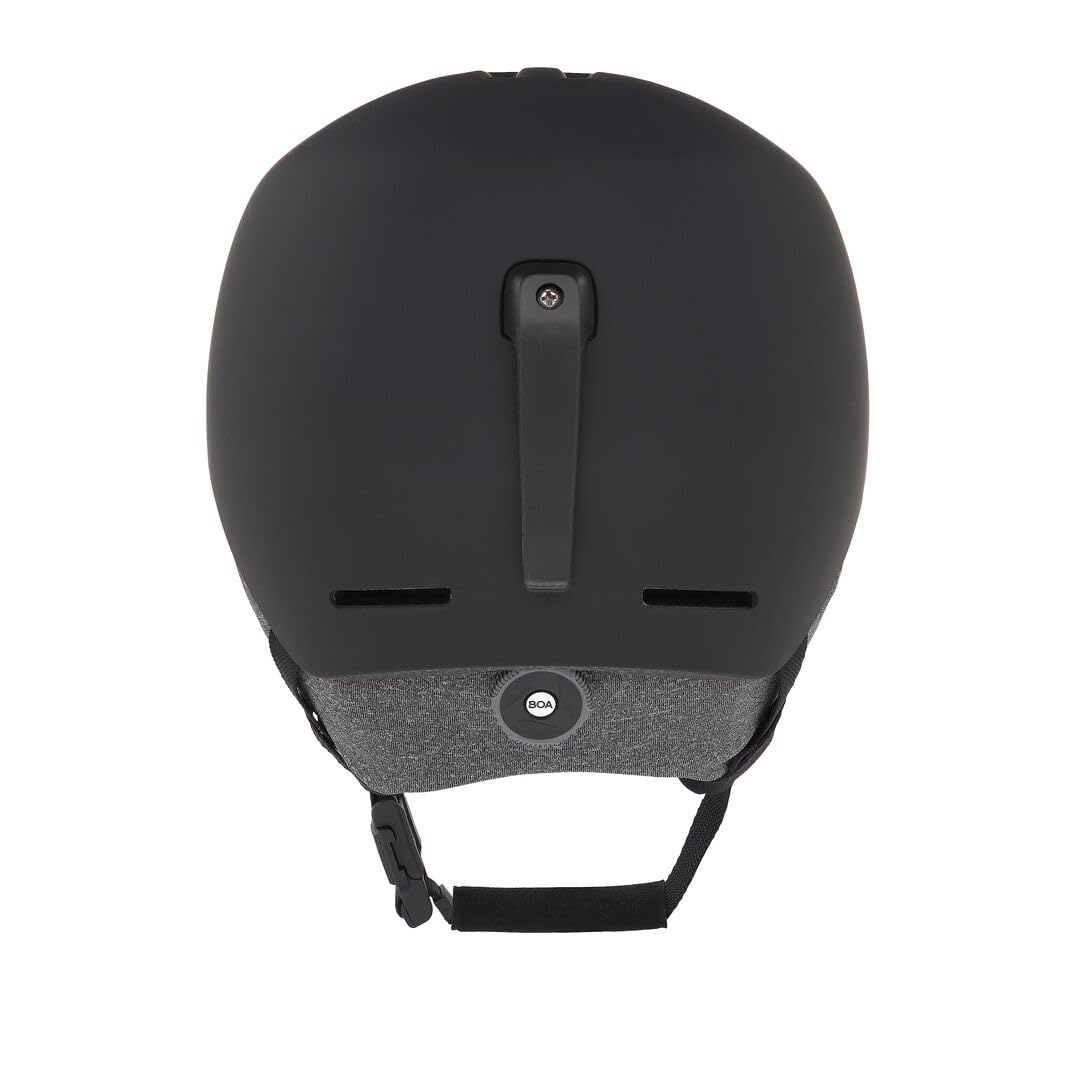 Oakley MOD1 worn on mountain showing integrated fit and goggle compatibility