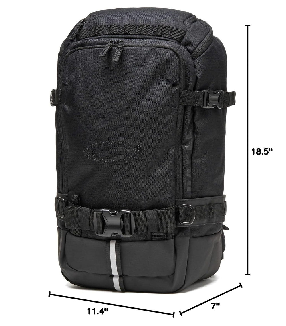 Oakley Peak RC 25L worn by rider on a snowy trail demonstrating real-world use
