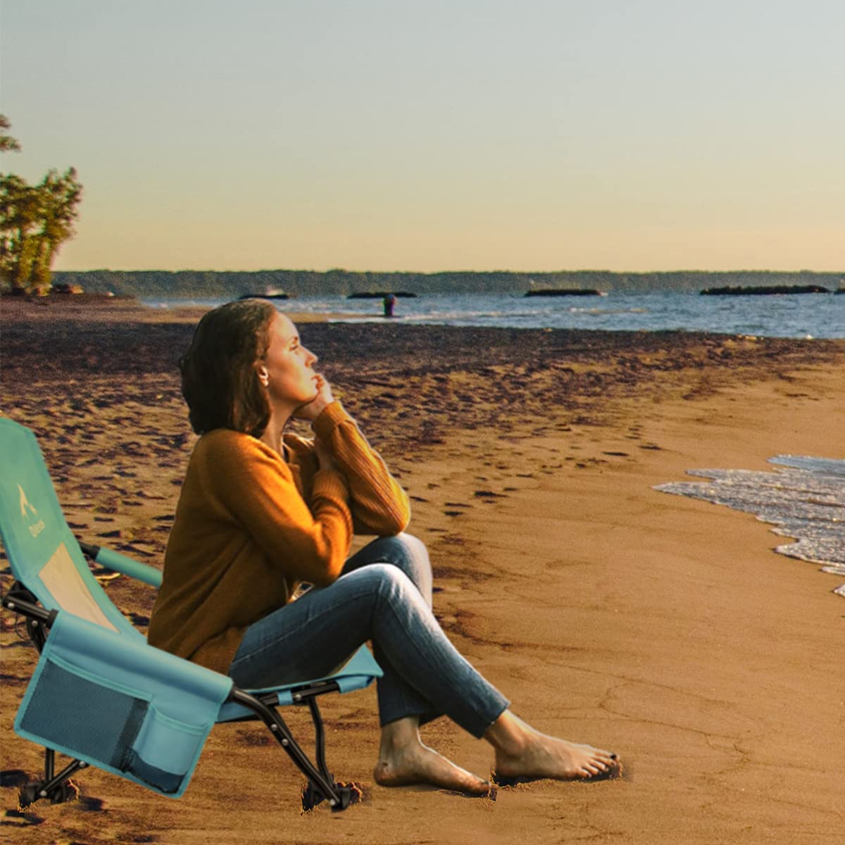 Oileus chair in use on sandy beach offering a relaxed seating solution