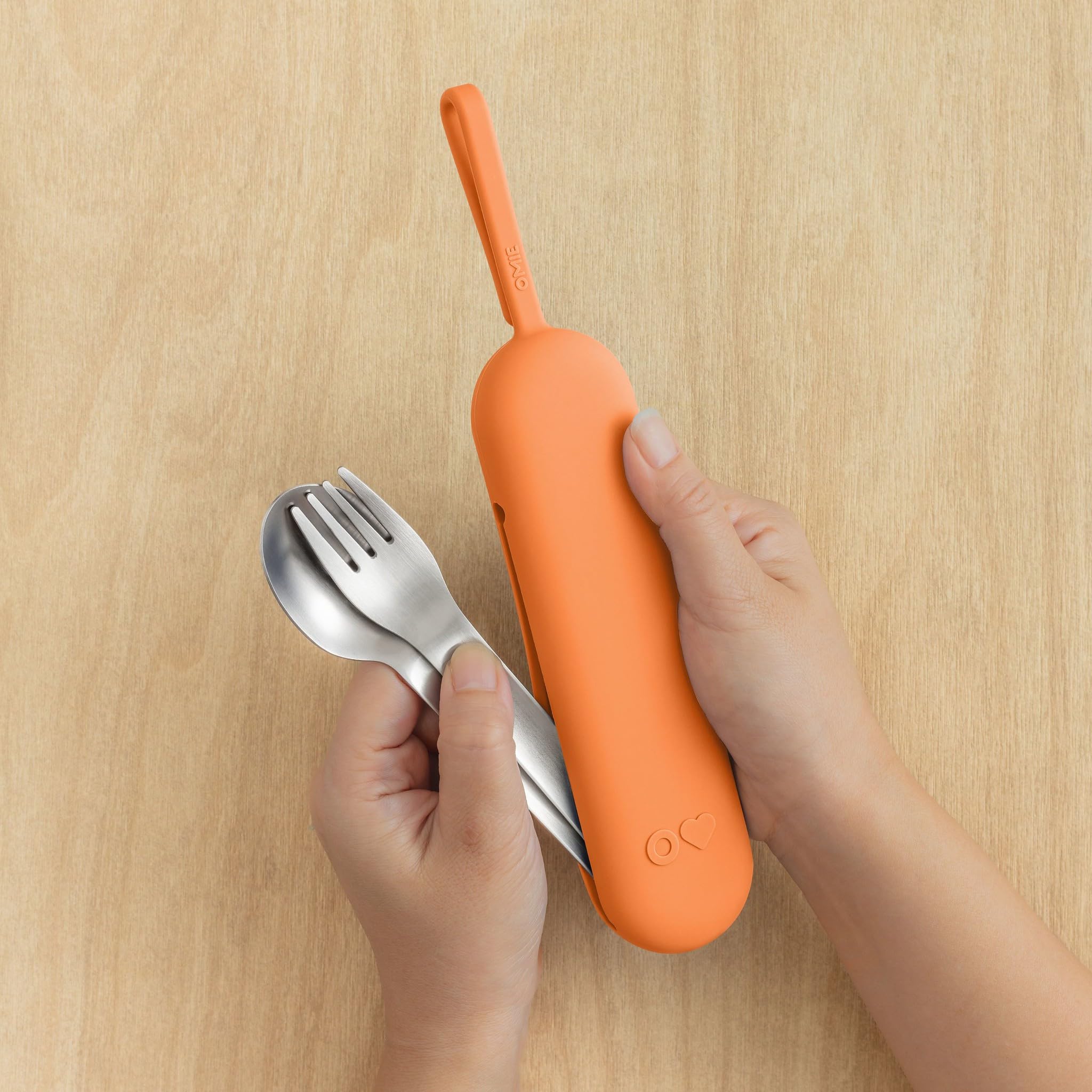 Omie open case with fork and spoon inside, organized and sanitary storage