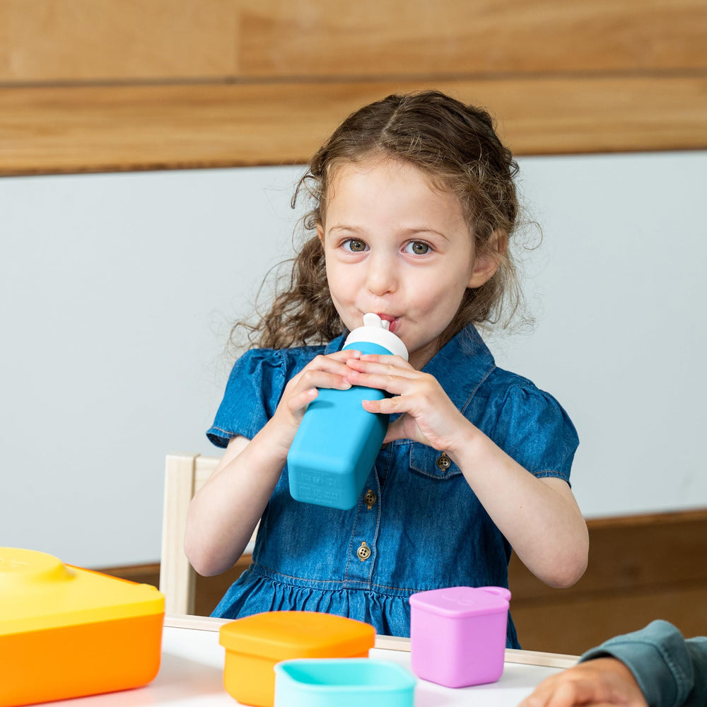 Omie bottle fitted inside OmieBox demonstrates space-saving lunch organization