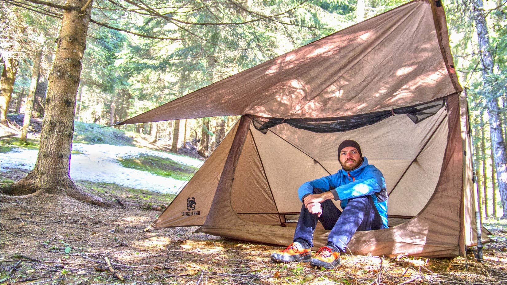 OneTigris tent in forest lifestyle scene showing low-visibility color and camp use