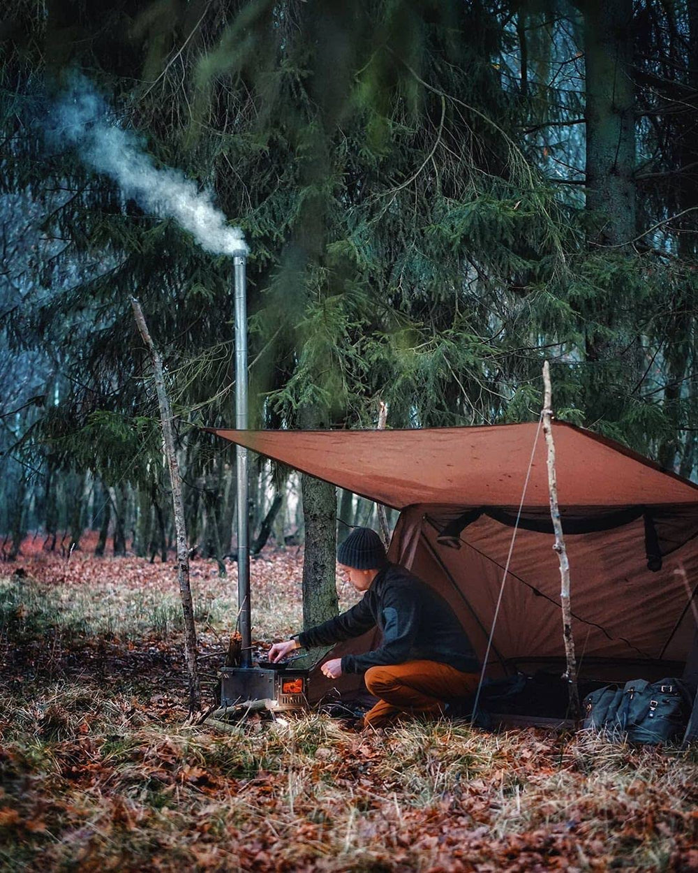 OneTigris porch setup with wood stove demonstrating safe cooking shelter and airflow