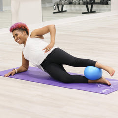 OPTP Franklin Method Air Ball used under knees during bridge for core activation benefit
