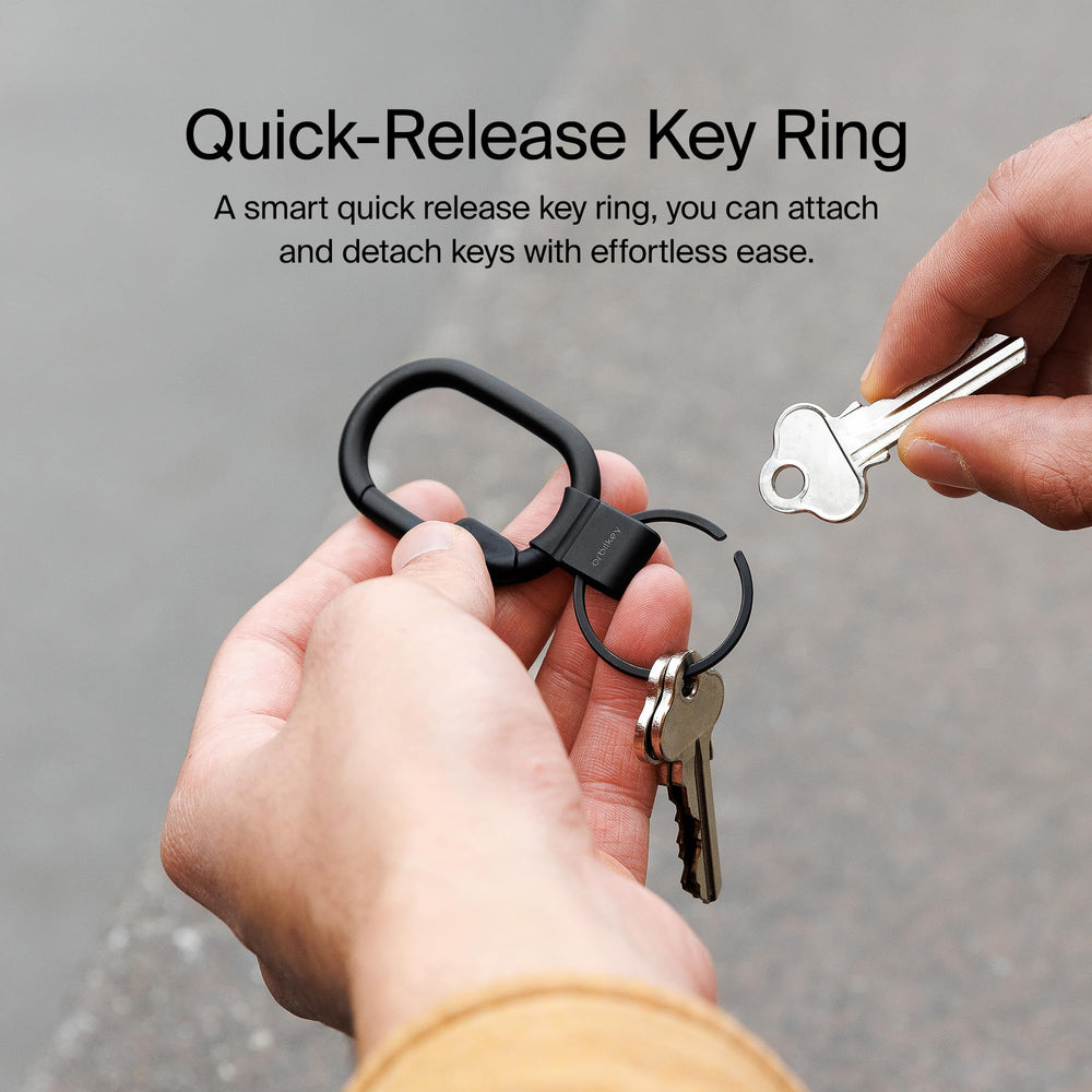 Orbitkey Clip Mini black clipped to belt loop for hands-free carry benefit