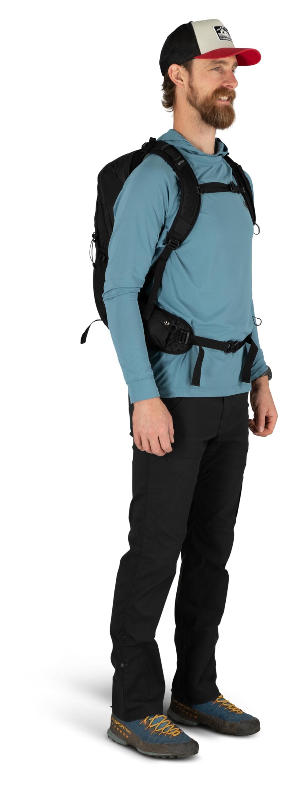 Osprey Talon beside hiking boot for size and capacity comparison while packing